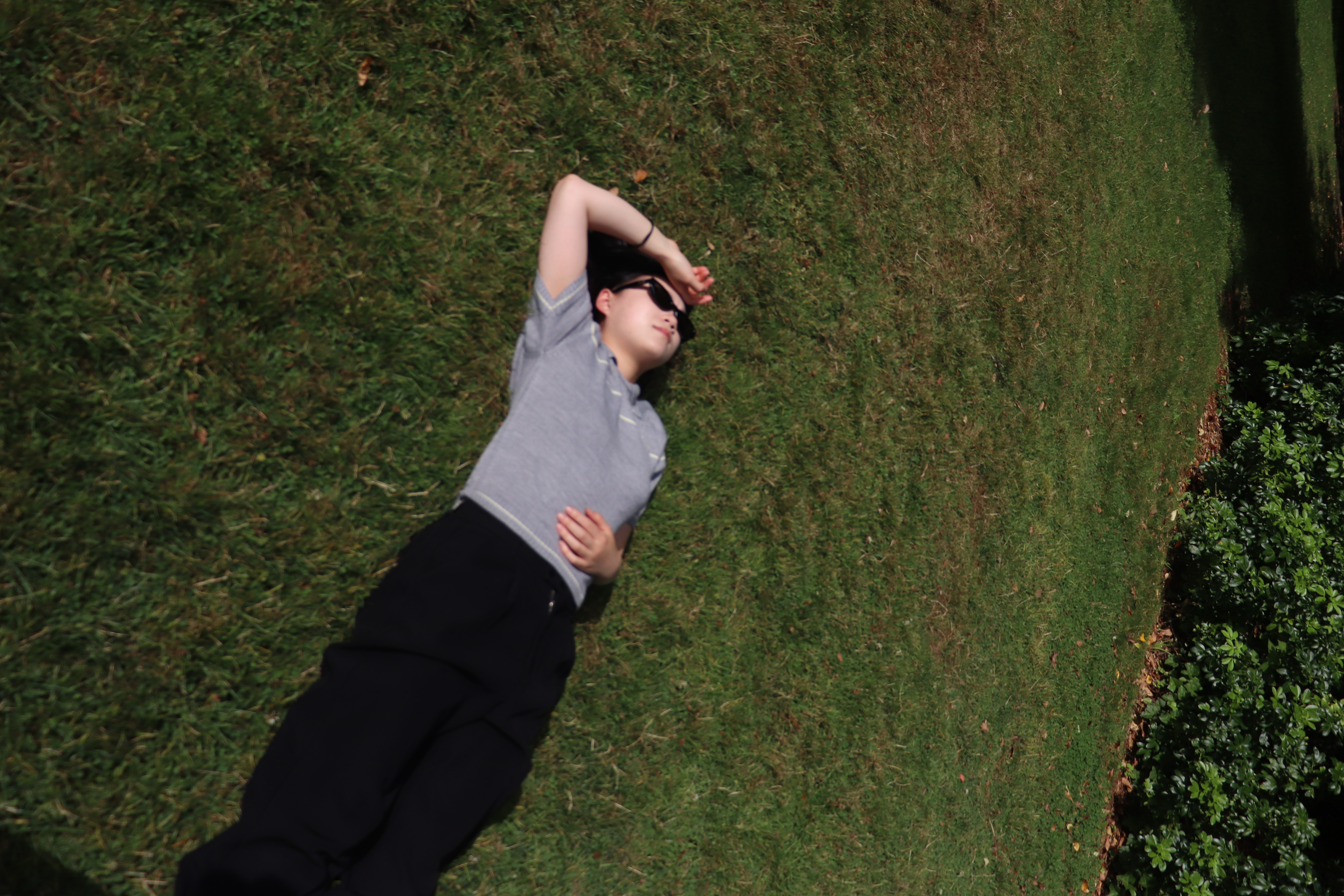 Emily lying on grass
